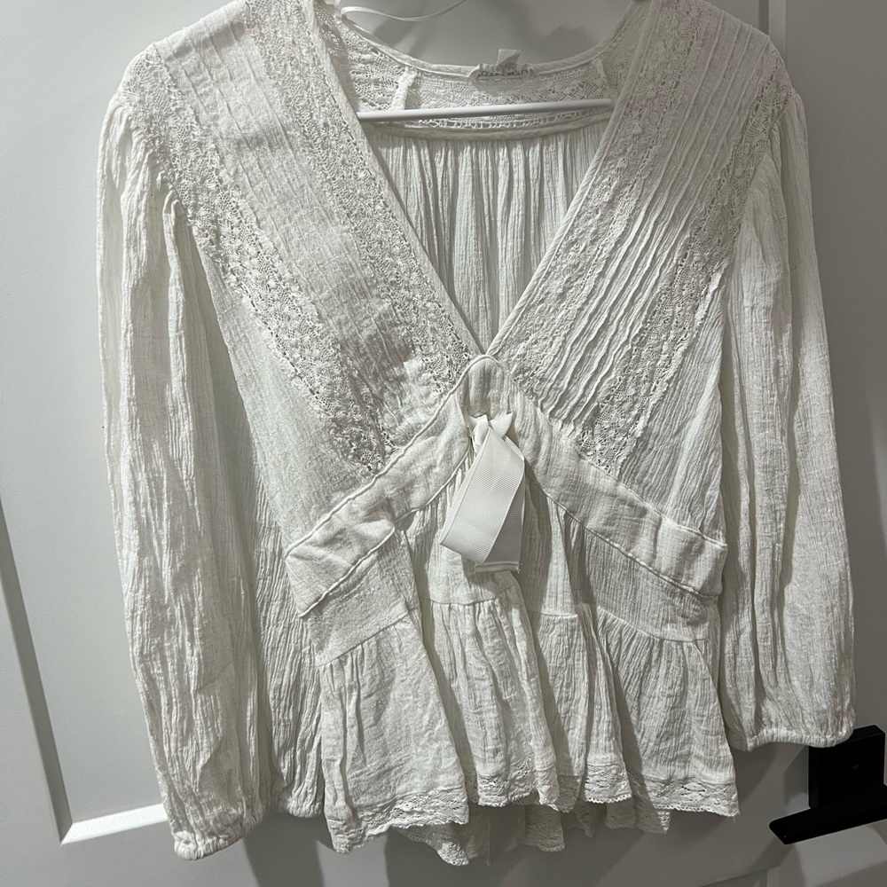 Low V Neck White Ruffled Blouse